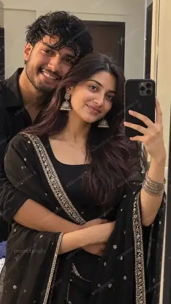 Hug pose mirror selfie AI photo prompt for couple - boy hugging girl from behind in matching black traditional outfits, taking a mirror selfie