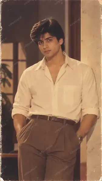 1980s Bollywood hero AI photo prompt - a young man in a cream rolled-sleeve shirt and pleated brown trousers leaning on a pillar
