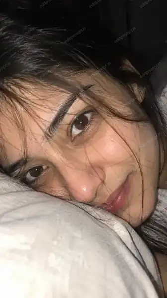 Night flash close up photo prompt — extreme close-up portrait of a girl resting on a pillow lit by direct phone flash